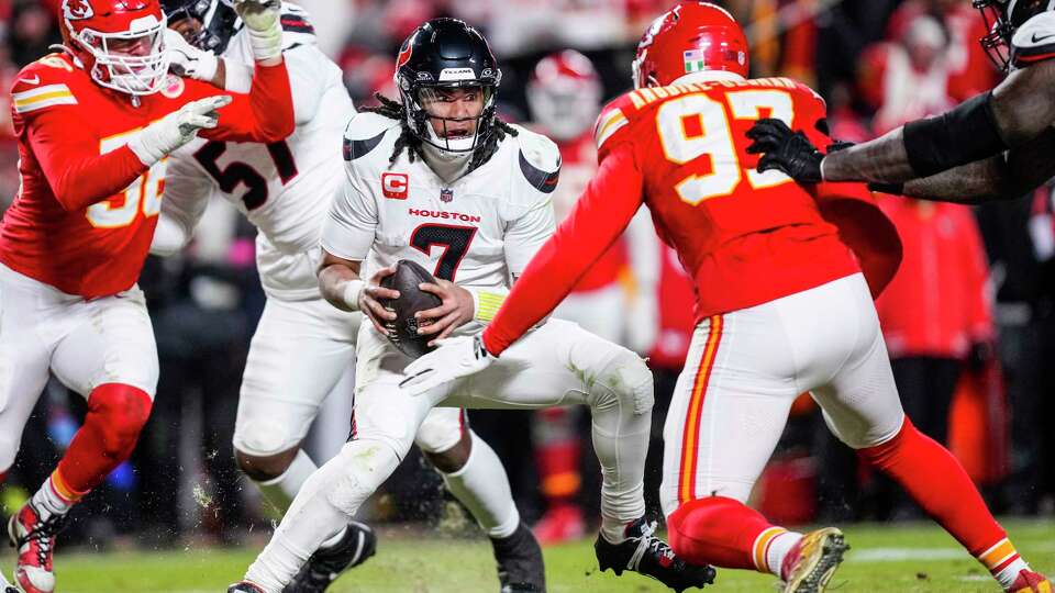 Houston Texans quarterback C.J. Stroud (7) is sacked by Kansas City Chiefs defensive end Felix Anudike-Uzomah (97) during the second half of an AFC divisional playoff football game, Saturday, Jan. 18, 2025, in Kansas City, Mo.