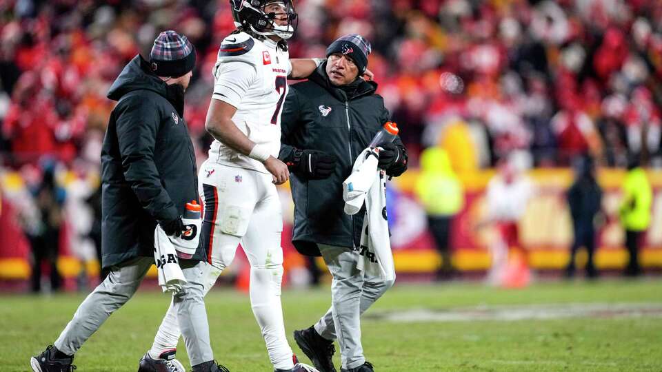 Houston Texans quarterback C.J. Stroud (7 is helped off the field by the training staff after he was sacked by Kansas City Chiefs defensive end George Karlaftis during the second half of an AFC divisional playoff football game, Saturday, Jan. 18, 2025, in Kansas City, Mo.