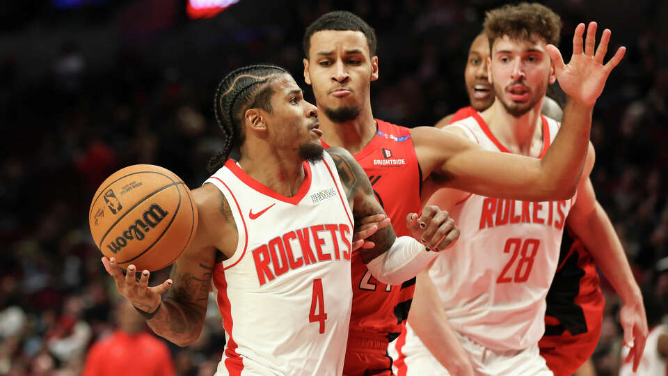 Houston Rockets guard Jalen Green (4) drives to the basket as Portland Trail Blazers forward Kris Murray (24) defends during the second half of an NBA basketball game Saturday, Jan. 18, 2025, in Portland, Ore. (AP Photo/Amanda Loman)