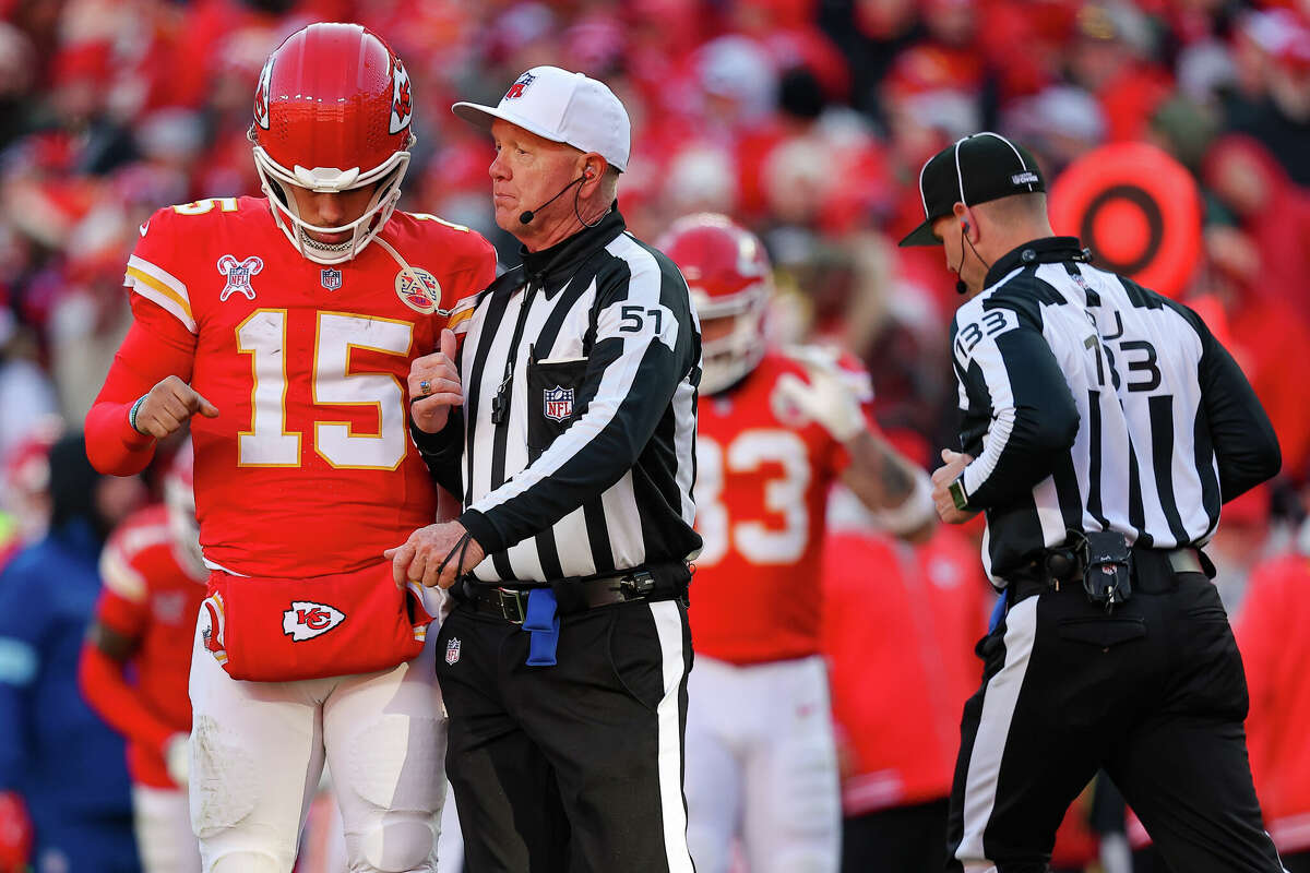 Referee Carl Cheffers speaks to Patrick Mahomes of the Kansas City Chiefs during a break in the third quarter against the Houston Texans at GEHA Field at Arrowhead Stadium on December 21, 2024 in Kansas City, Missouri.