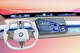 BMW's Panoramic iDrive interface features a dash-spanning display