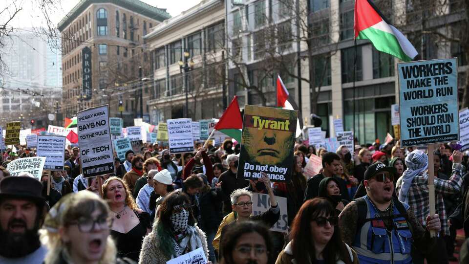 In advance of inauguration on Monday, an anti-Trump march heads down Market Street in San Francisco on Sunday, January 19, 2025.