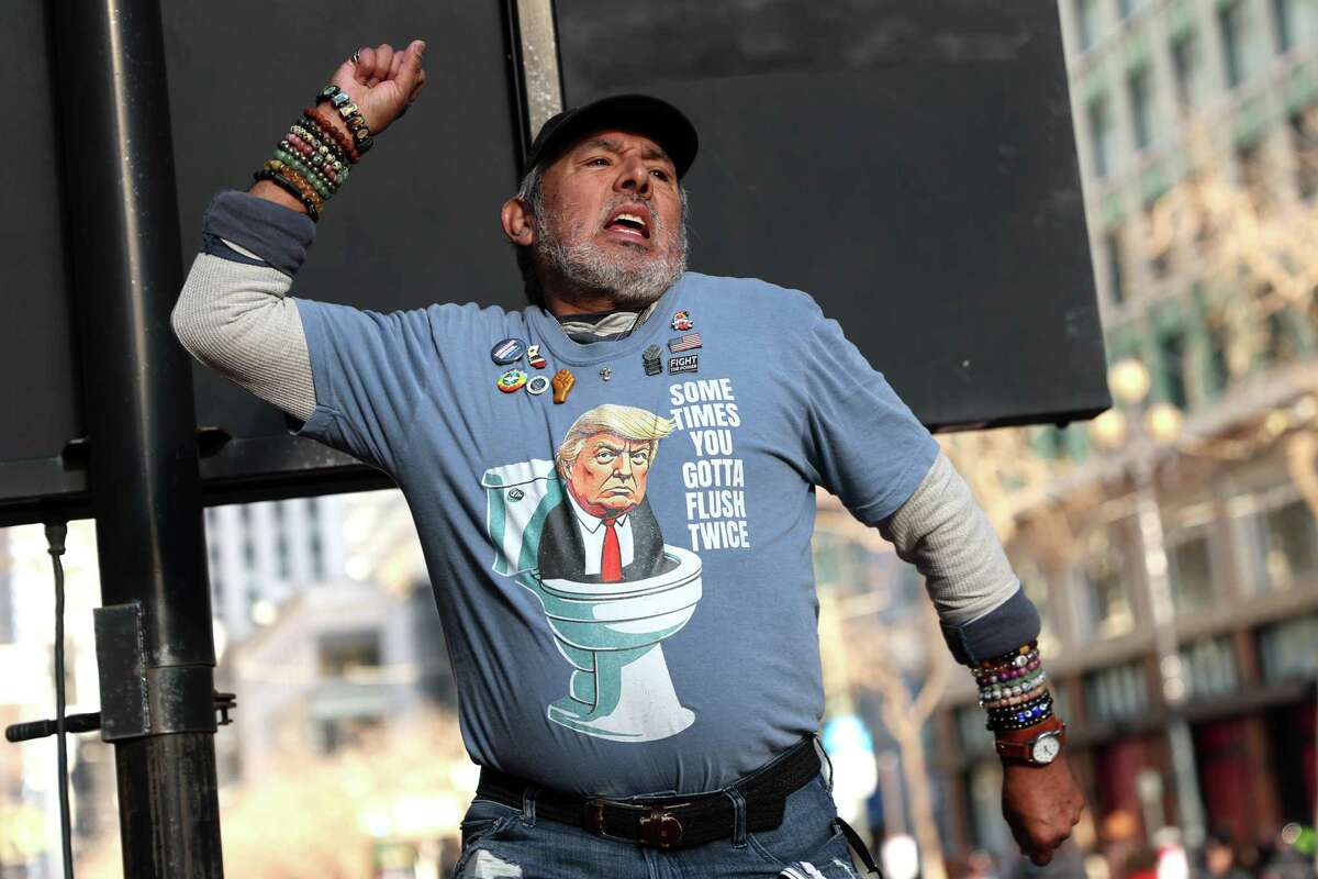 In advance of inauguration on Monday, Jim Martinez of San Francisco reacts during an anti-Trump on Market Street in San Francisco on Sunday, January 19, 2025.