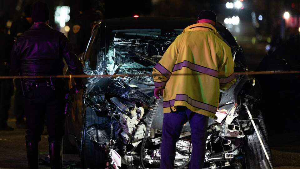 A Tesla rests at a crash scene which involved a Waymo car at Sixth and Harrison Streets in San Francisco on Sunday, Jan. 19, 2025.