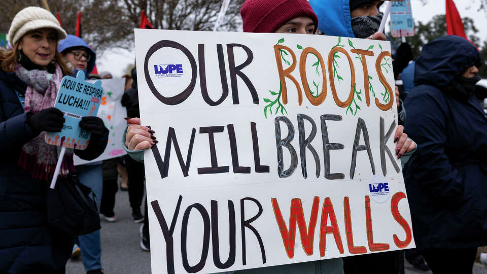 Members and supporters of La Union del Pueblo Entero (LUPE) march in protest of President Donald Trump during his inauguration in McAllen on Jan. 20, 2025. Trump supporters followed the marchers in their cars flying flags in support of President Donald Trump.