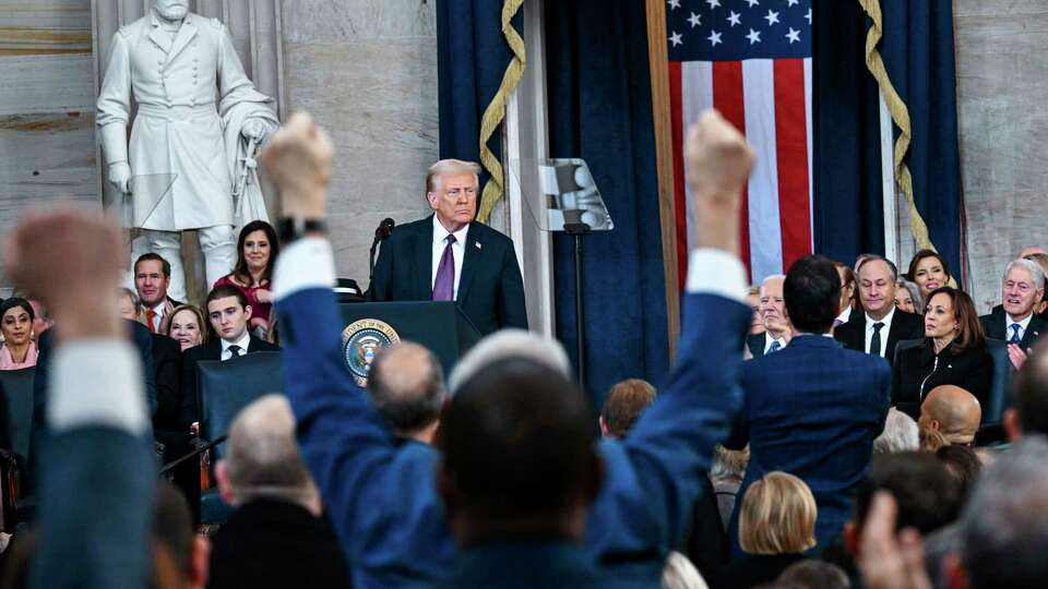 Attendees cheer as President Donald Trump speaks after taking the oath of office during the 60th Presidential Inauguration in the Rotunda of the U.S. Capitol in Washington, Monday, Jan. 20, 2025. (Kenny Holston/The New York Times via AP, Pool)