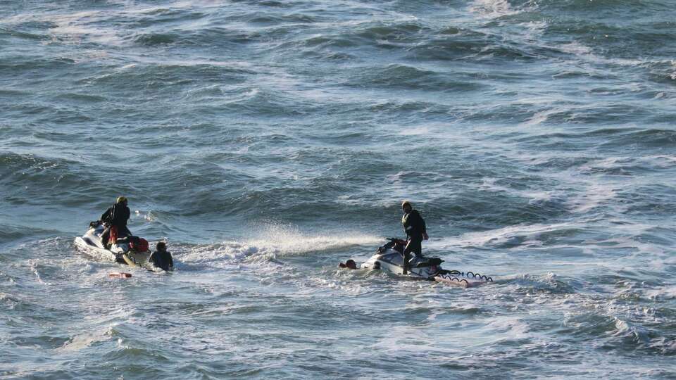 Search crews head out on Cowell Ranch State Beach just south of Half Moon Bay in an attempt to rescue an 8-year-old boy and a 39-year-old man from the water Sunday afternoon. Both died despite lifesaving efforts, a state parks spokesperson said.