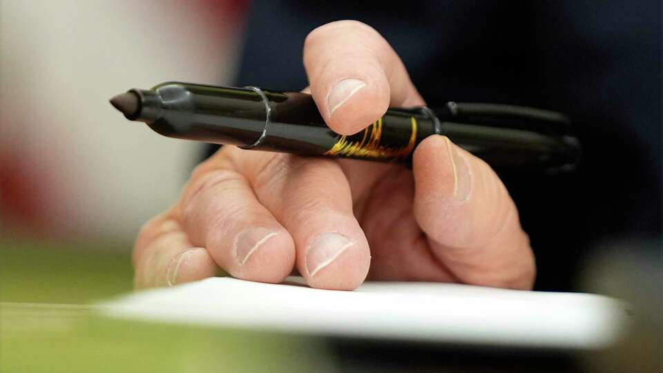 President Donald Trump signs executive orders in the Oval Office of the White House, Monday, Jan. 20, 2025, in Washington.