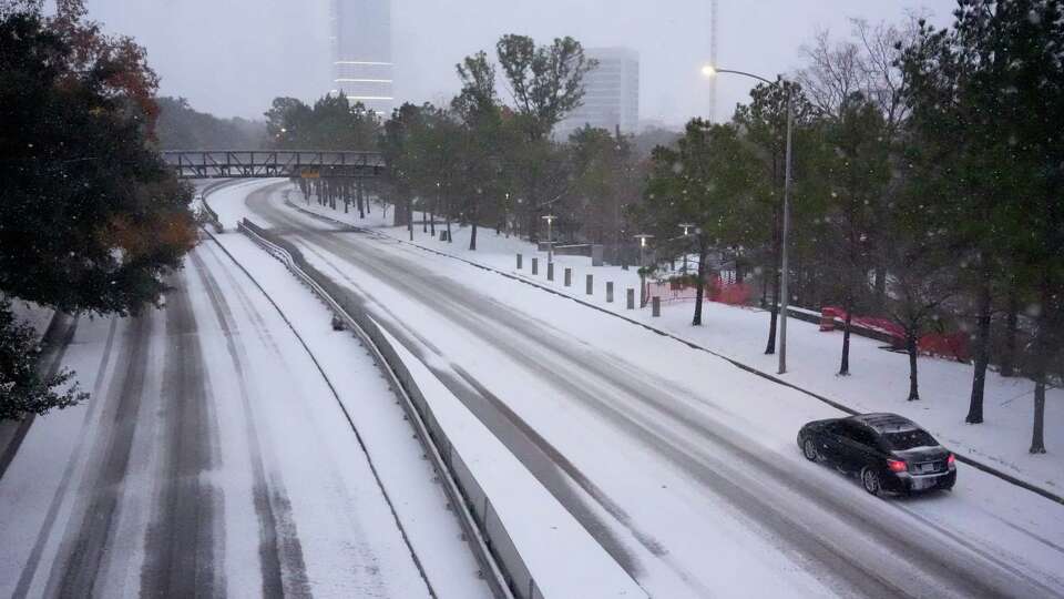 A car makes it way down Memorial Drive on Tuesday, Jan. 21, 2025 in Houston.