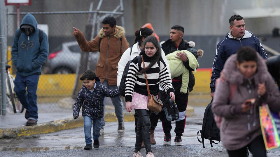 Migrants seeking asylum leave an immigration office after their scheduled meetings were canceled and they were turned away soon after President Donald Trump canceled the CBP One app, Monday, Jan. 20, 2025, in Matamoros, Mexico. (AP Photo/Eric Gay)