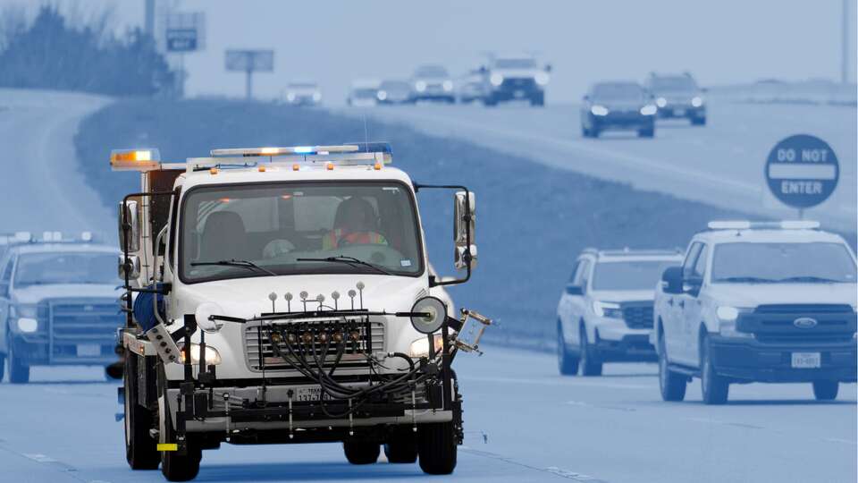 A TxDOT truck used to apply a brine solution to help prevent ice from sticking on roads is shown along the feeder road of SH249 near FM1960 Monday, Jan. 20, 2025, in Houston.