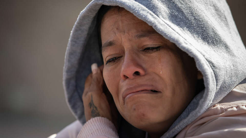 Milagro Gonzalez, of Venezuela, cries Monday, Jan. 20, 2025, after receiving news that her CBP One appointment for Tuesday was cancelled as part of President Donald Trump's border crackdown. Gonzalez and many other migrants had been watching Trump's inaugural speech on television at the Juventud 2000 shelter in Tijuana before receiving the news. (Ana Ramirez/The San Diego Union-Tribune/TNS)