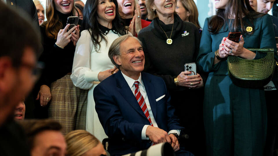 WASHINGTON, DC - JANUARY 20: Texas Governor Greg Abbott (R) looks on as President Donald Trump addresses guests and supporters in an overflow room in Emancipation Hall after his inauguration at the U.S Capitol on January 20, 2025 in Washington, DC. Donald Trump takes office for his second term as the 47th President of the United States. (Photo by Greg Nash-Pool/Getty Images)