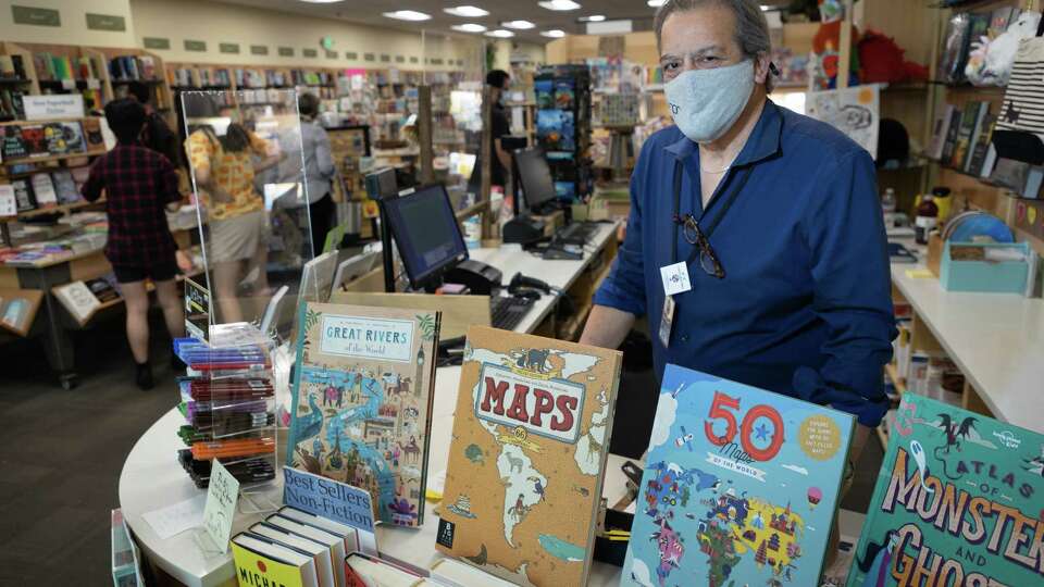 Books Inc manager Glen Robbe poses for a portrait at Books Inc on Wednesday, June 2, 2021 in Mountain View, Calif. Under Santa Clara County's new health orders requiring companies to ascertain all employees' vaccination status, Books Inc manager Glen Robbe wonders what he can ask when interviewing applicants for open jobs.