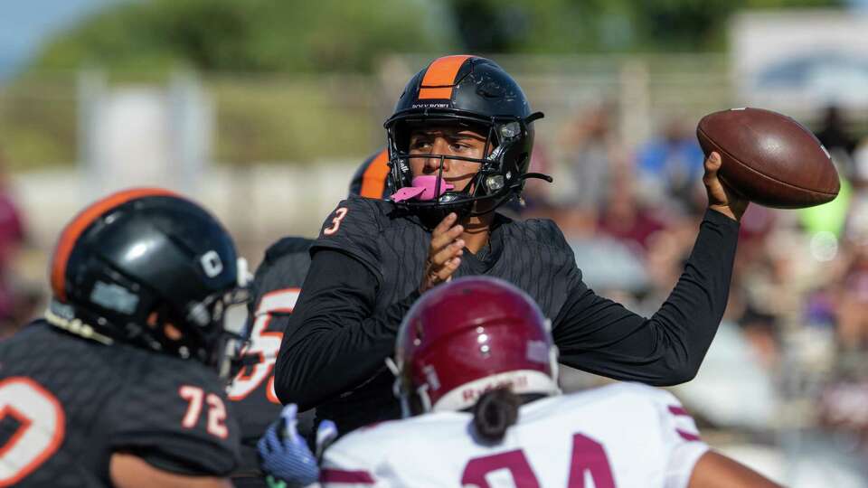 James Campbell high school quarterback Jaron-Keawe Sagapolutele fires a pass before the pass rush can get to him in a game against W.R. Farrington high school on Sept. 14, 2024, in Ewa Beach, Hawaii.