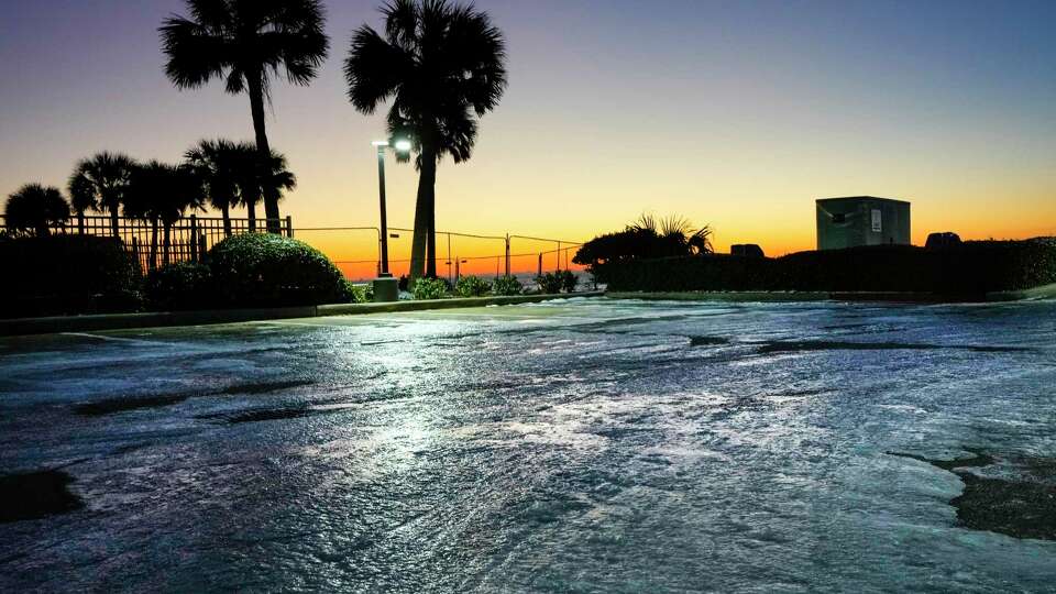 Ice and snow remain on the ground as the sun rises over the Gulf of Mexico in the aftermath of an icy winter storm on Wednesday, Jan. 22, 2025 in Galveston.