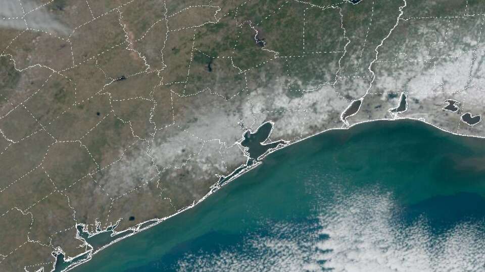 Snow from Tuesday's winter storm is still visible on the ground across Southeast Texas, left, and the southwest corner of Louisiana, top right, in this weather satellite photo taken around 11 a.m. Wednesday.