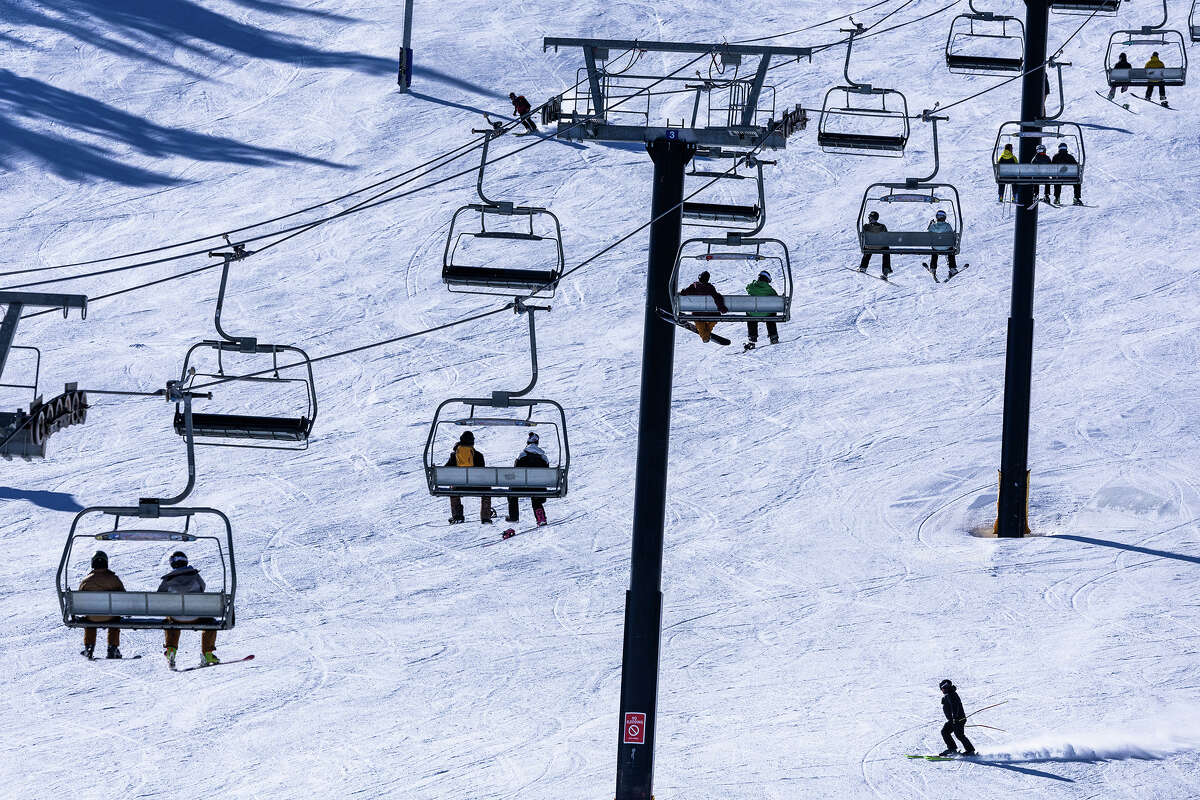 A skier traverses Stump Alley under a chairlift at Mammoth Mountain on Wednesday, Dec. 4, 2024 in Mammoth Lakes, CA.