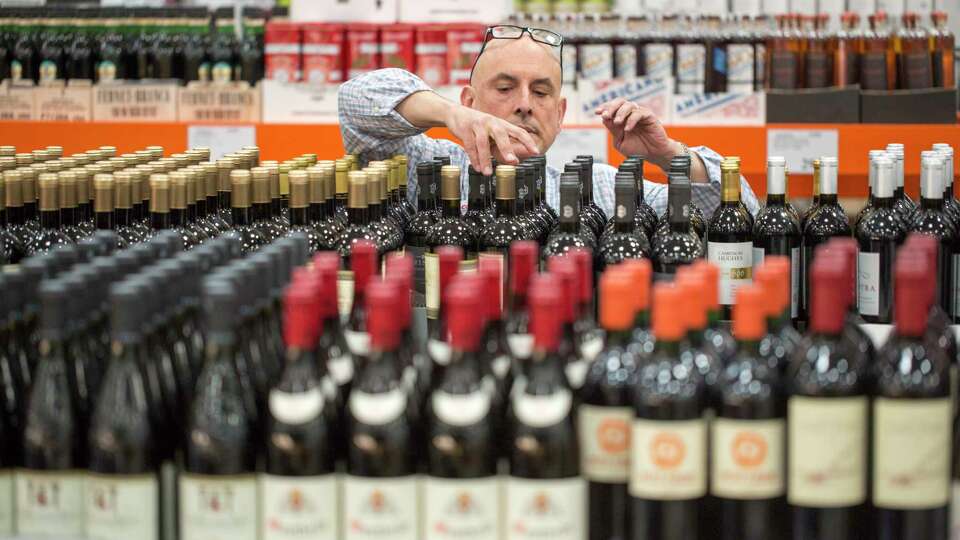 Paul Ferris, a wine steward at Costco, stocks wine Monday, Dec. 12, 2016 in San Francisco, CA at Costco. FERRIS IS NOT A TEMPORARY WORKER