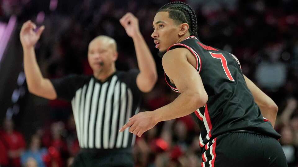 Houston guard Milos Uzan (7) reacts after making a 3-pointer during the second half of an NCAA men’s college basketball game, Wednesday, Jan. 22, 2025, in Houston.