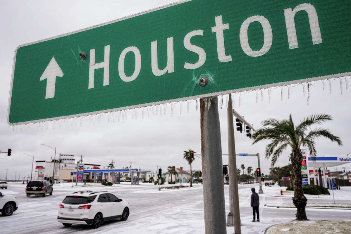  Icicles hand from a sign pointing the way to Houston during an icy winter storm on Tuesday, Jan. 21, 2025 in Galveston.