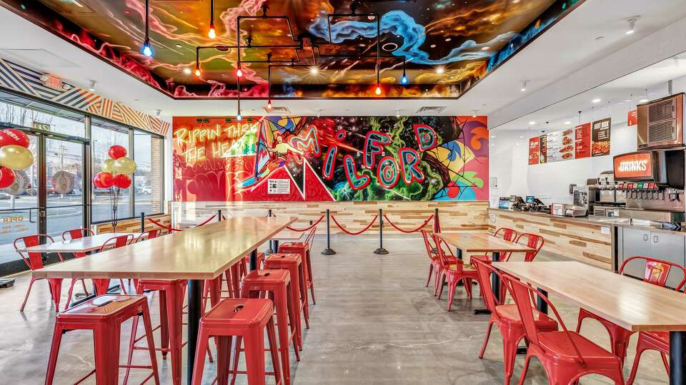 Dining room inside Dave’s Hot Chicken in Milford.