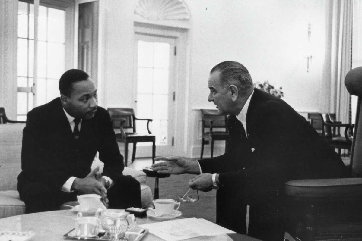 President Lyndon B Johnson with US Civil Rights leader Dr Martin Luther King Jr at the White House,Washington DC, December 1963. Dr King, head of the Southern Christian Leadership Conference, was one of the civil rights leaders who consulted with the new president. (Photo by Okamoto/PhotoQuest/Getty Images)