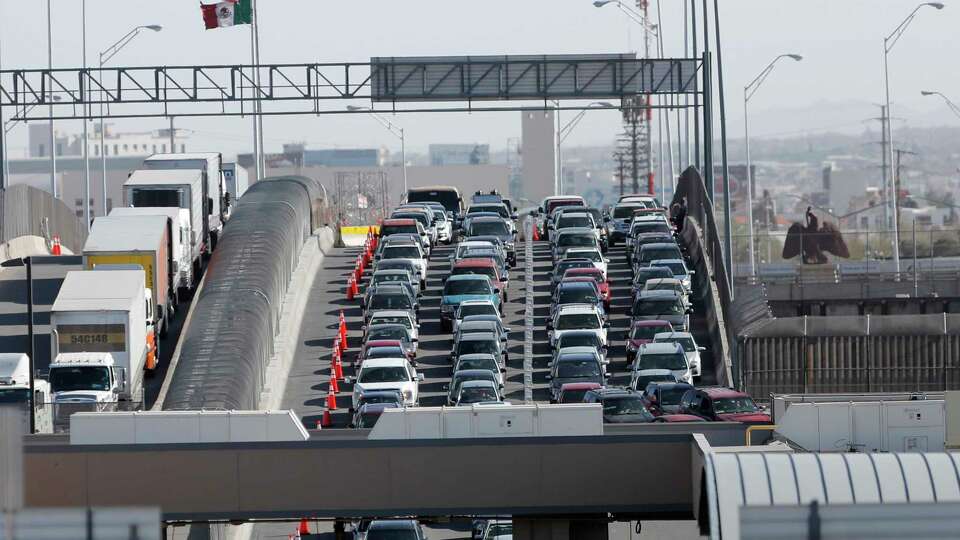 FILE - Cars and trucks line up to enter the U.S. from Mexico at a border crossing in El Paso, Texas, March 29, 2019. Most Americans think the U.S. has been significantly changed by immigrants over the past five years and while many agree immigrants contribute to the economy, there are broad concerns that even legal immigration brings risks as well, according to a new poll from The Associated Press-NORC Center for Public Affairs Research, conducted March 21-25, 2024. (AP Photo/Gerald Herbert, File)