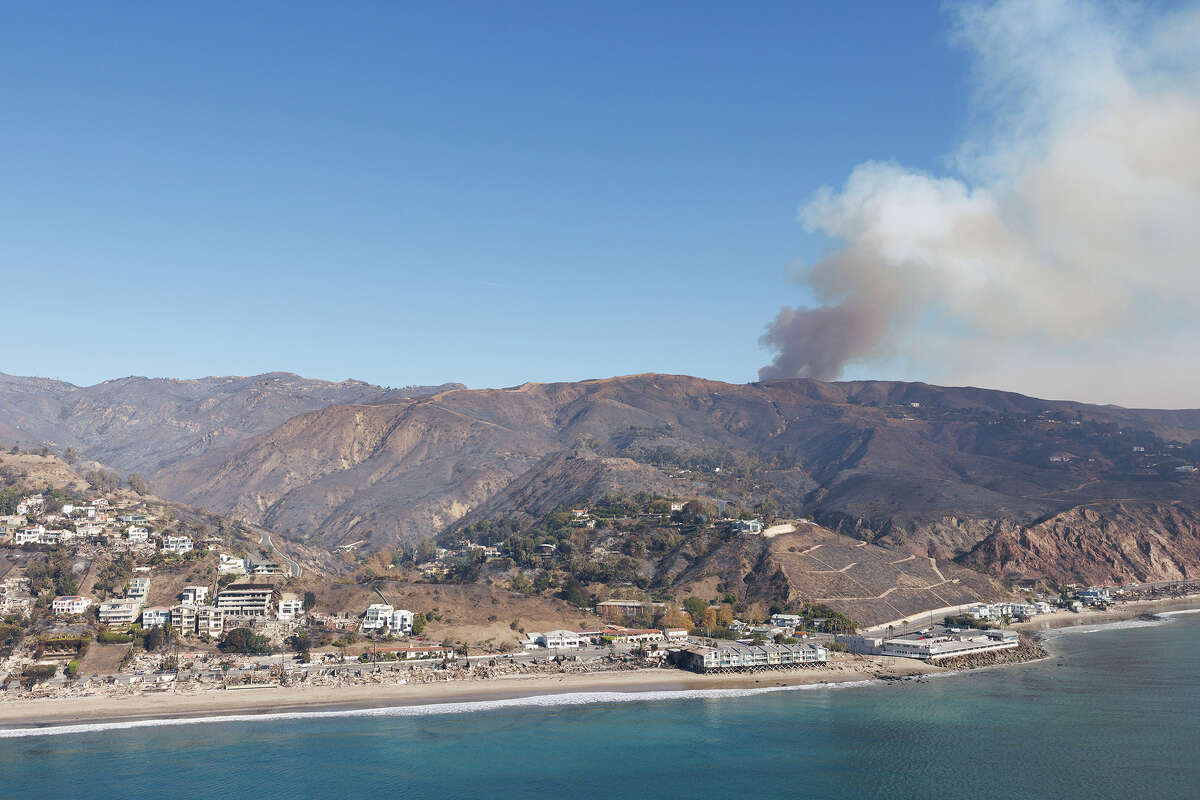 Smoke from Pacific Palisades along Pacific Coast Highway near Malibu where homes are burned down. 