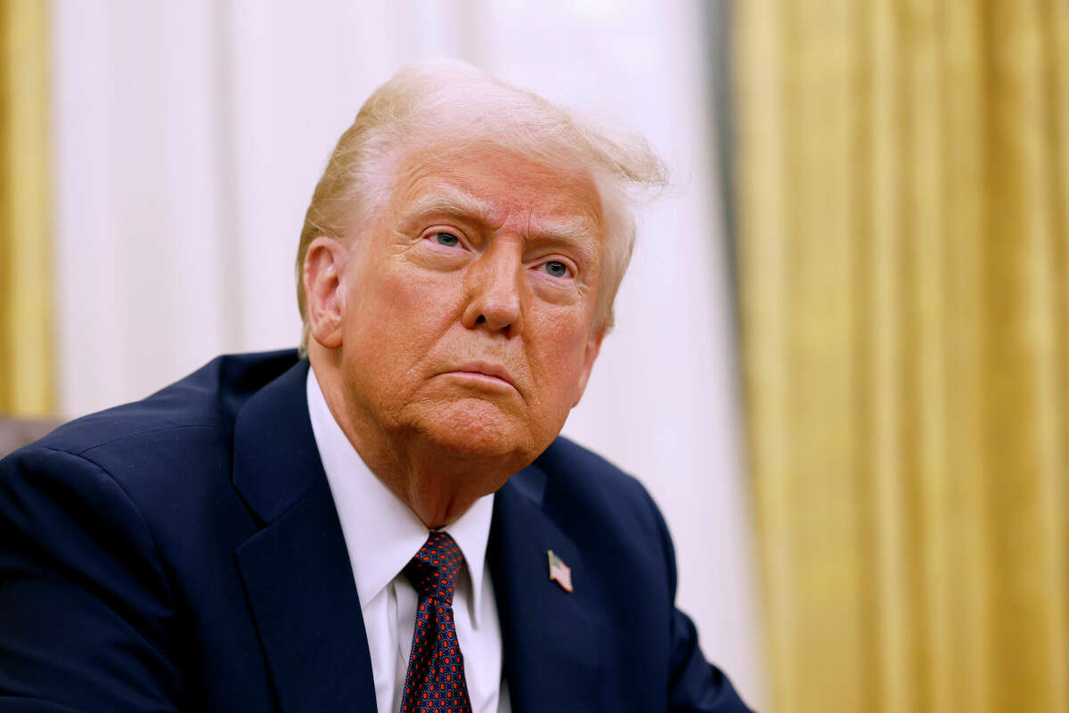 U.S. President Donald Trump speaks to reporters after signing a series of executive orders in the Oval Office of the White House on January 23, 2025 in Washington, DC.