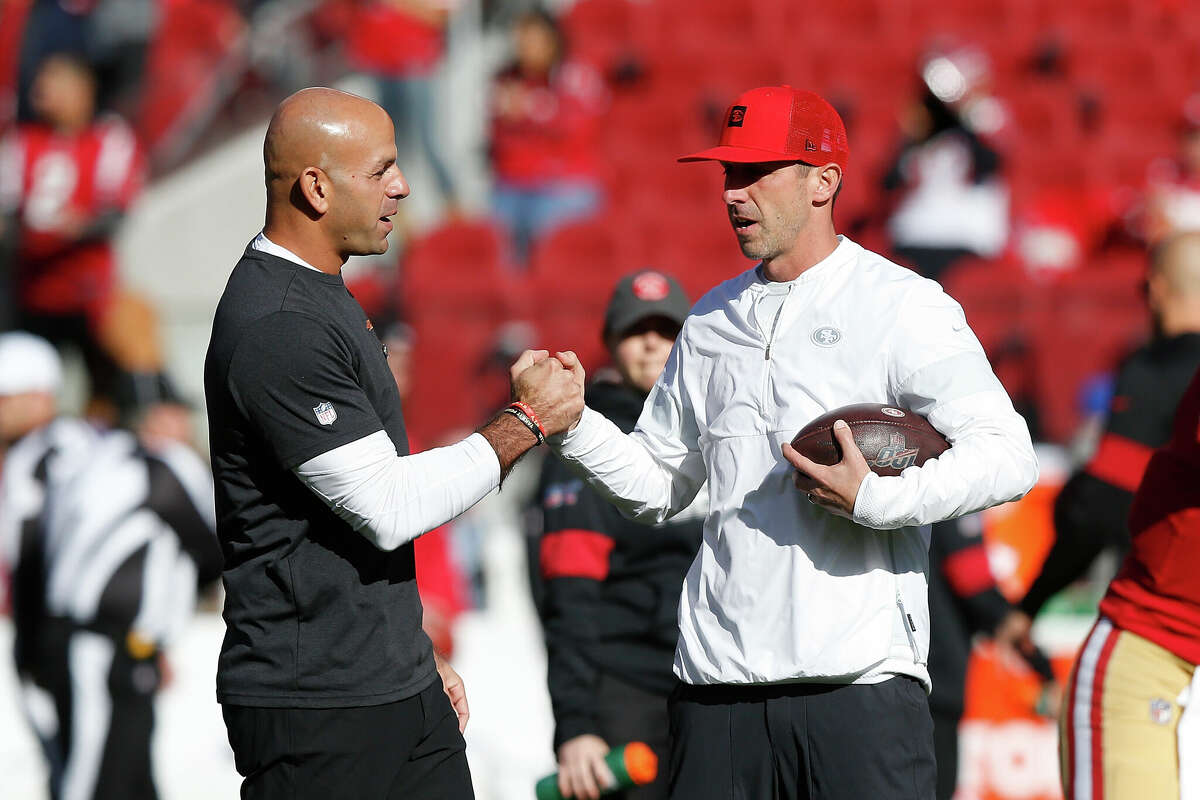 Head coach Kyle Shanahan of the San Francisco 49ers talks to then-defensive coordinator Robert Saleh during the warm up before the game against the Atlanta Falcons at Levi's Stadium on December 15, 2019 in Santa Clara, California.