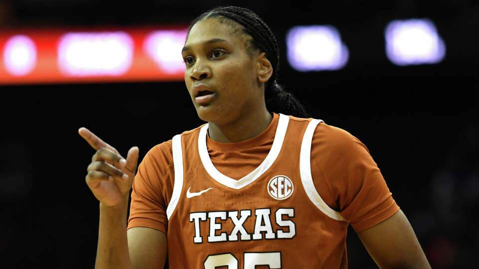 Texas forward Madison Booker (35) gestures to teammates during the first half of an NCAA college basketball game against Maryland Monday, Jan. 20, 2025, in Newark, N.J. (AP Photo/Pamela Smith)