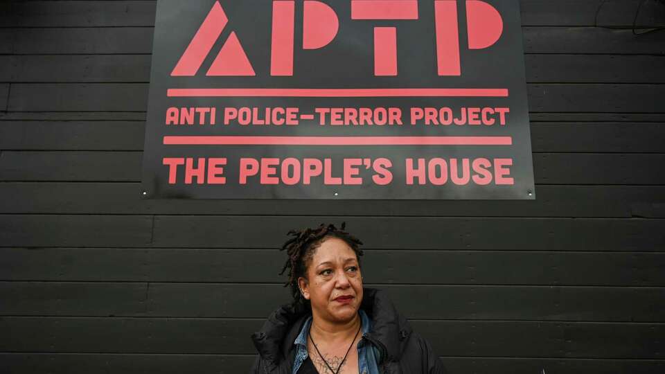 Executive Director of Anti Police-Terror Project Cat Brooks stands in front of The People’s House as it opens to the public in Oakland, Calif. on Saturday, Jan. 14, 2023. (Samantha Laurey/Special to the S.F. Chronicle)