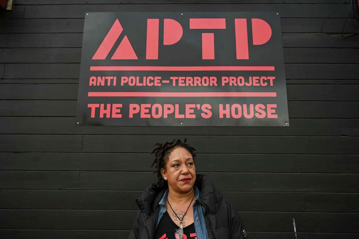 Executive Director of Anti Police-Terror Project Cat Brooks stands in front of The People’s House as it opens to the public in Oakland, Calif. on Saturday, Jan. 14, 2023. (Samantha Laurey/Special to the S.F. Chronicle)