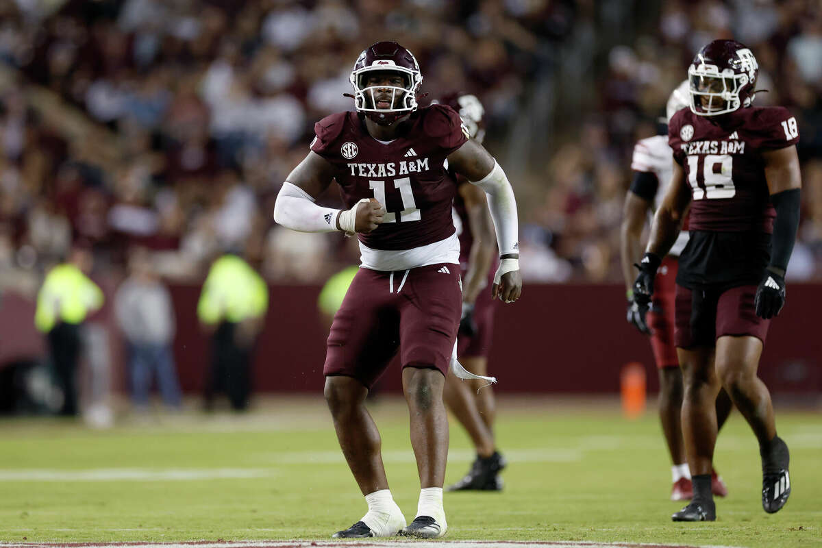 Nic Scourton #11 of the Texas A&M Aggies reacts after a tackle in the second half against the New Mexico State Aggies at Kyle Field on November 16, 2024 in College Station, Texas. 