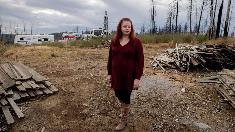 Planks of wood now remains where Jennifer McKim-Hibbard’s home once stood in Grizzly Flats, Calif. on Wednesday, Nov. 13, 2024. It’s been over three years since the Caldor Fire destroyed her home and displaced her family. Before the fire, McKim-Hibbard was paying upwards of $4,000 a year for her home insurance, nearly three times the state average. McKim-Hibbard, who was a FAIR Plan policyholder, said when her home burnt down it took over a year for them to get their payout. And when they did it was under $200,000, less than a third of what she and her husband believes they’d receive based on their policy limits. Now, McKim-Hibbard said she is concerned for those victims with FAIR Plan policies in Los Angeles.