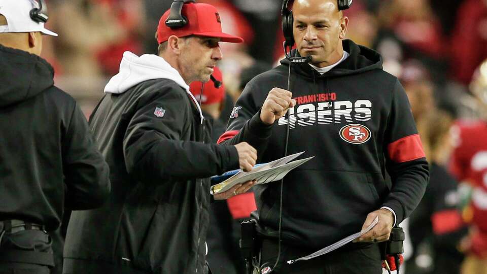 San Francisco 49ers’ defensive coordinator Robert Saleh fist bumps head coach Kyle Shanahan in the second quarter during the NFC Championship game between the San Francisco 49ers and the Green Bay Packers at Levi’s Stadium on Sunday, Jan. 19, 2020 in Santa Clara, Calif.