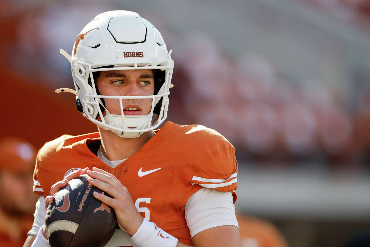 AUSTIN, TEXAS - NOVEMBER 23: Arch Manning #16 of the Texas Longhorns warms up before the game against the Kentucky Wildcats at Darrell K Royal-Texas Memorial Stadium on November 23, 2024 in Austin, Texas. (Photo by Tim Warner/Getty Images)