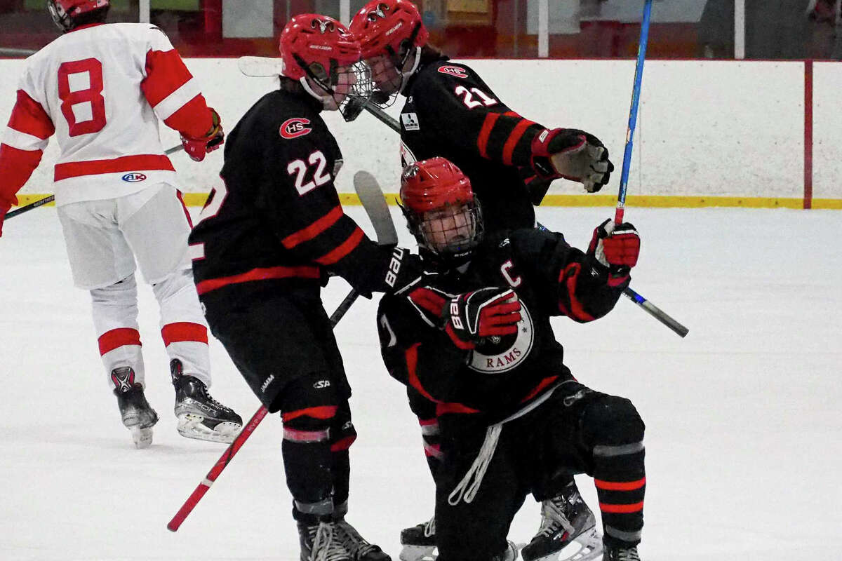 Cheshire's Devin Kelly (17), kneeling, celebrates a goal against Greenwich during boys' high school hockey action in Greenwich, Conn., on Saturday January 25, 2025.