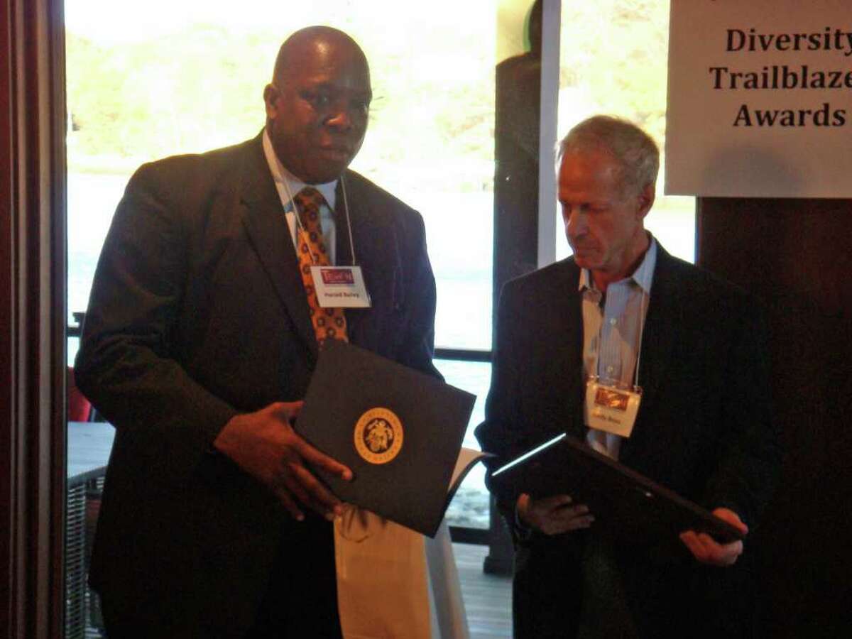 TEAM Westport chairman Harold Bailey Jr. honors diversity award recipient Andy Boas during a ceremony on Sunday, Nov. 7, 2010.