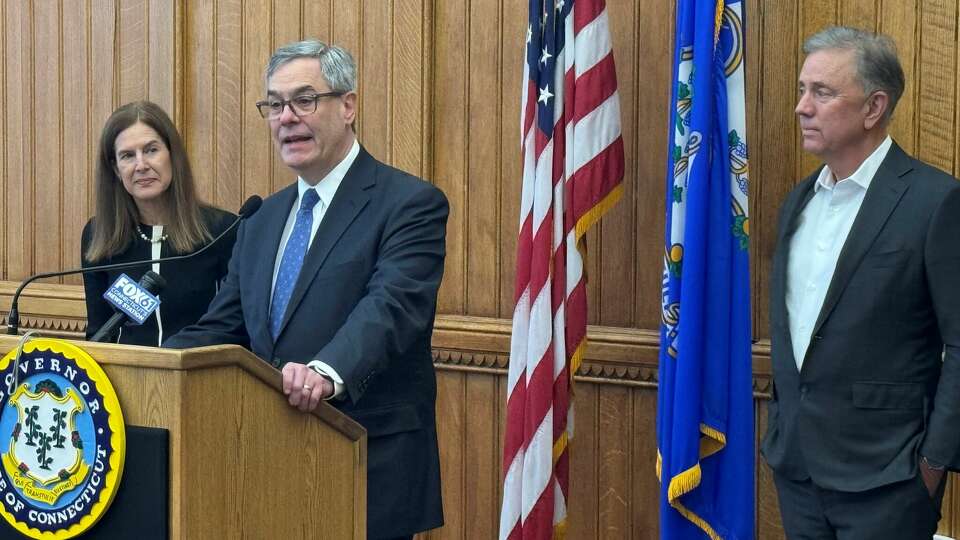 State Appellate Chief Judge William Bright was nominated by Gov. Ned Lamont on Monday to become a member of the state Supreme Court. Lt. Gov. Susan Bysiewicz is on the left.