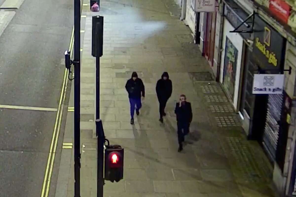 Screenshot of CCTV shows three men,