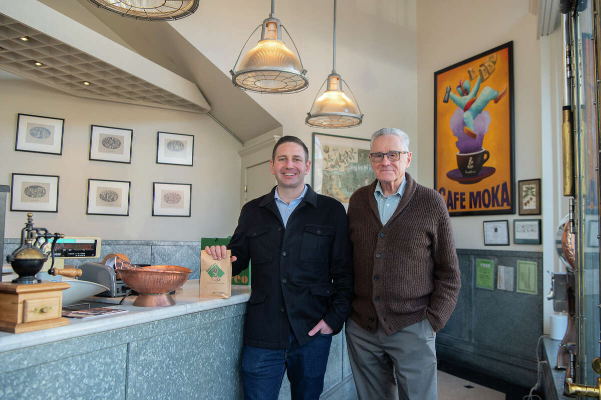 Walter Haas III, left, poses for a photo with longtime Graffeo Coffee owner Luciano Repetto inside the store front of Graffeo Coffee Roasting Co. in North Beach, on Thursday, Jan. 23, 2025. 