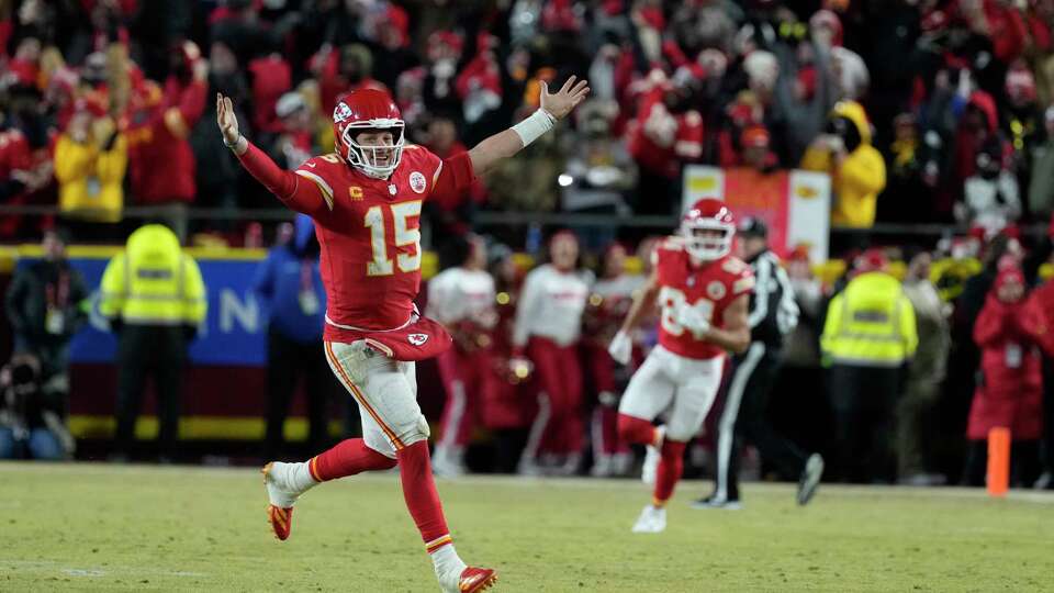 Kansas City Chiefs quarterback Patrick Mahomes (15) celebrates after defeating the Buffalo Bills in the AFC Championship NFL football game, Sunday, Jan. 26, 2025, in Kansas City, Mo. (AP Photo/Ed Zurga)