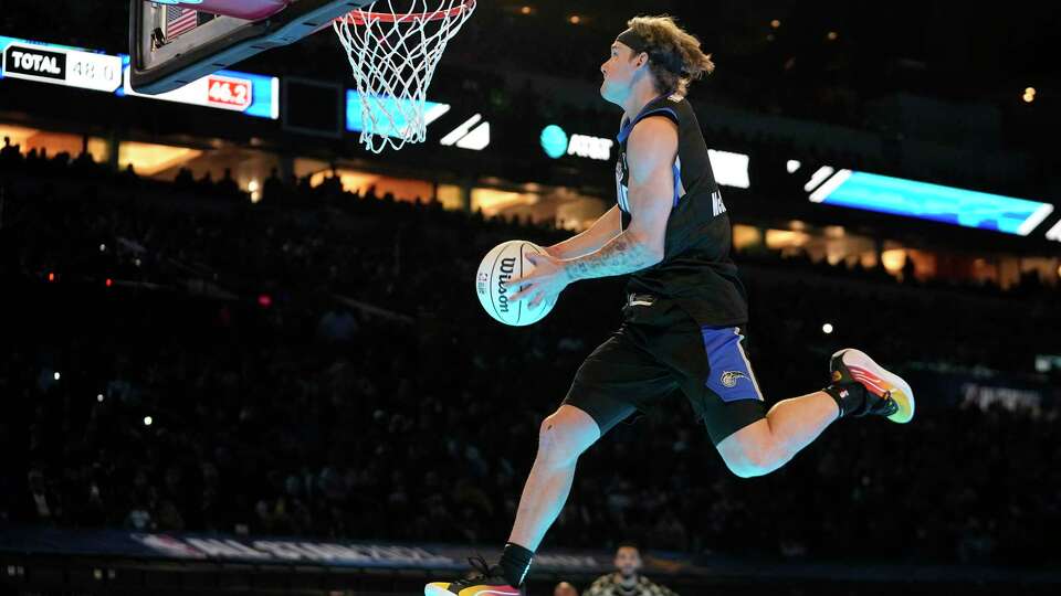 Osceola Magic's Mac McClung dunks during the slam dunk competition at the NBA basketball All-Star weekend, Saturday, Feb. 17, 2024, in Indianapolis. (AP Photo/Darron Cummings)