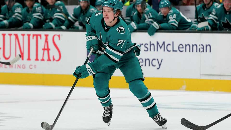 San Jose Sharks center Macklin Celebrini (71) skates with the puck against the Pittsburgh Penguins during the first period of an NHL hockey game in San Jose, Calif., Monday, Jan. 27, 2025.