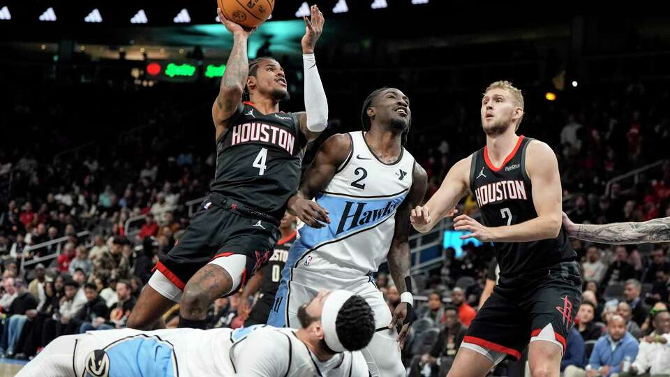 Houston Rockets guard Jalen Green (4) shoots against the Atlanta Hawks during the first half of an NBA basketball game, Tuesday, Jan. 28, 2025, in Atlanta. (AP Photo/Mike Stewart)