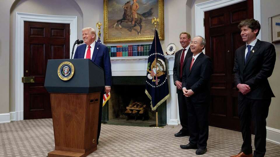 U.S. President Donald Trump, accompanied by, from left, Oracle CTO Larry Ellison, SoftBank CEO Masayoshi Son, and OpenAI CEO Sam Altman, speaks during a news conference in the Roosevelt Room of the White House on Tuesday, Jan. 21, 2025, in Washington, D.C.