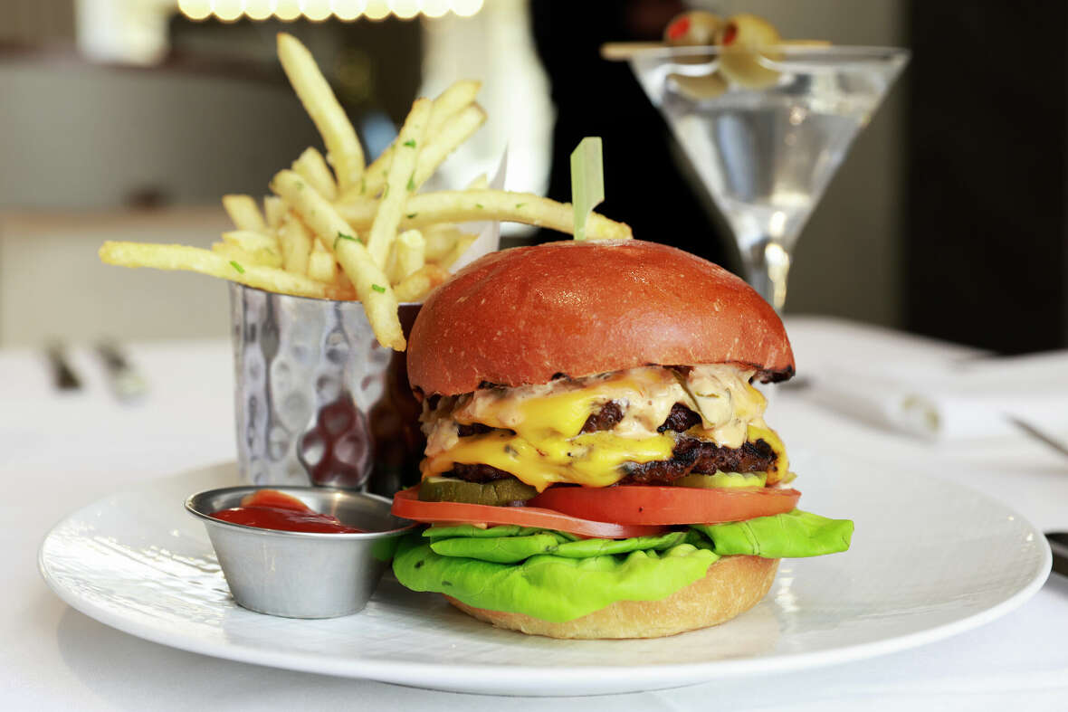 The burger and fries served with a martini at The Rotunda at Neiman Marcus in San Francisco, California Thursday, Dec. 19, 2024.