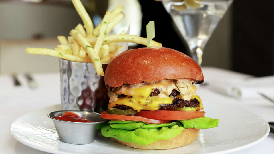 The burger and fries served with a martini at The Rotunda at Neiman Marcus in San Francisco, California Thursday, Dec. 19, 2024.